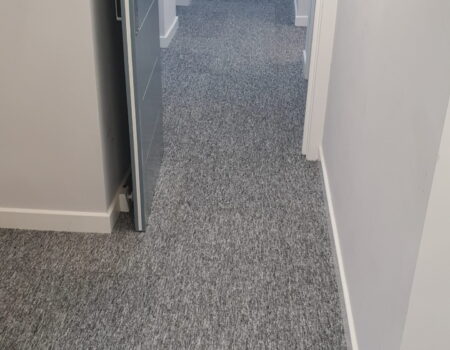 Top Drawer Construction white door and carpet fitting in apartment hallway Woking Weybridge Surrey