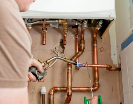 A local Top Drawer Construction plumber fixing and installing home boiler heating system Woking Weybridge Surrey